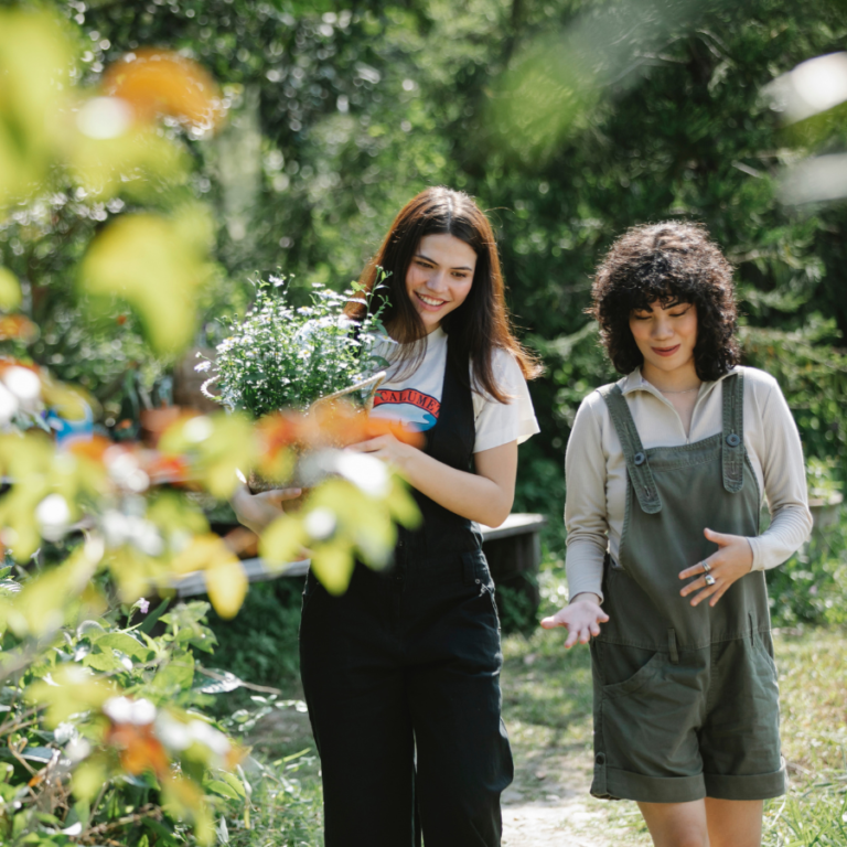 Two women talking about plants.