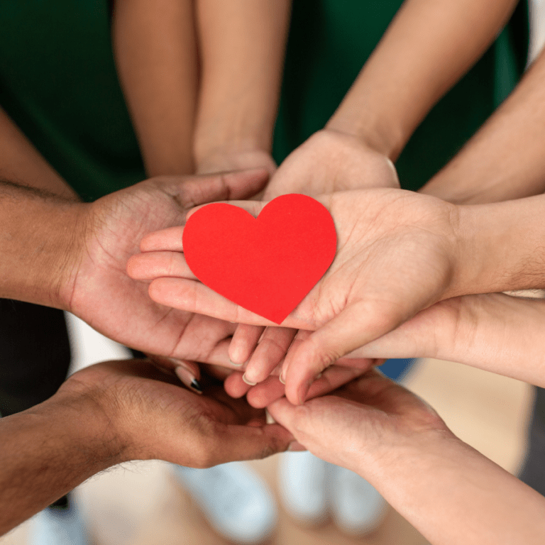 Hands holding heart.