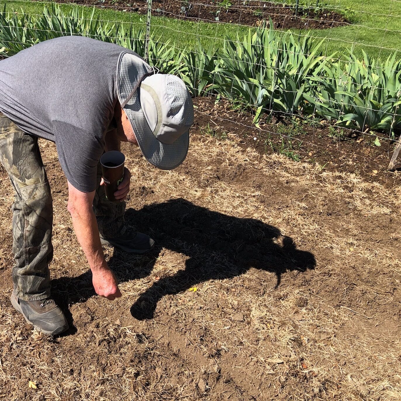 Man planting seeds.