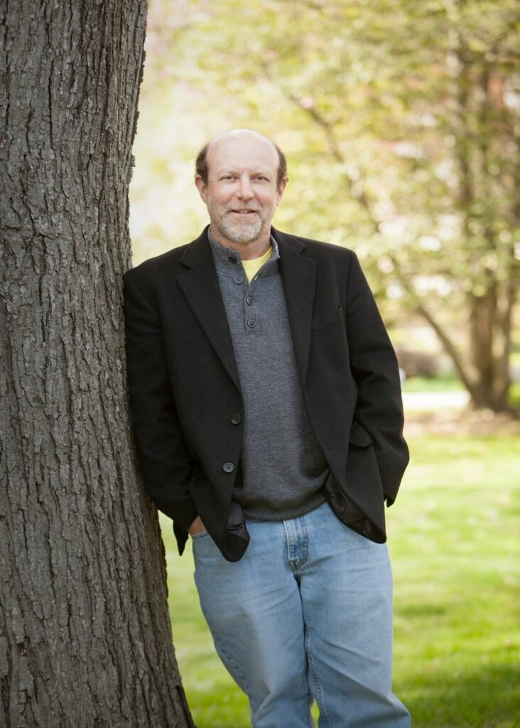 Larry Weaner standing next to a tree