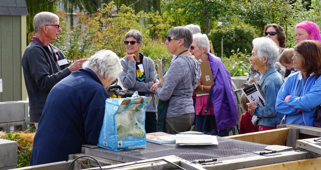 Group of people learning about composting